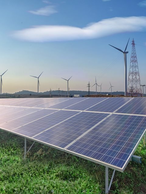 renewable-energy-solar-panels-wind-turbines-green-grass-blue-sky renewable-energy-solar-panels-wind-turbines-green-grass-blue-sky